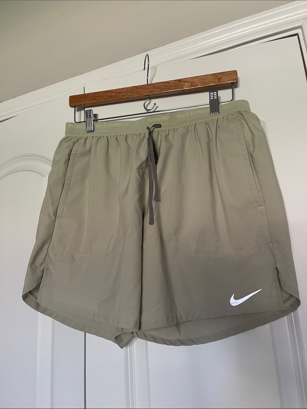 Nike Olive Green Athletic Running Shorts with White Swoosh